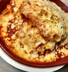 a dish of chicken parmesan